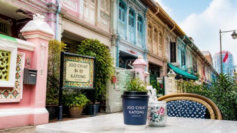 Colorful Peranakan shophouse street in Joo Chiat and Katong, Singapore with a café table