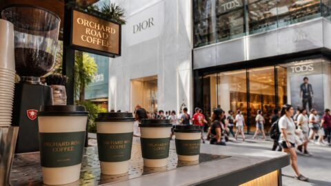 Branded paper coffee cups at an Orchard Road cafe in Singapore