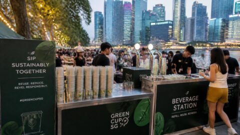Outdoor festival event along the Singapore River waterfront utilizing reusable cups