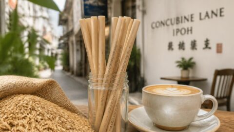 Agricultural byproduct-based compostable straws and raw materials next to specialty coffee in Ipoh