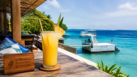 Iced tropical beverage with a paper straw at a luxury beach resort in Mactan Island, Cebu