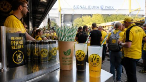 Concession stand with eco-friendly paper straws and reusable cups at Signal Iduna Park in Dortmund