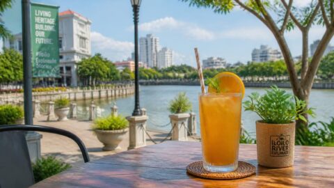 Cold beverage with a paper straw at a café overlooking the Iloilo River Esplanade