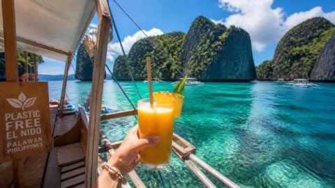 Refreshment with a paper straw on a boat during an island-hopping tour in El Nido, Palawan